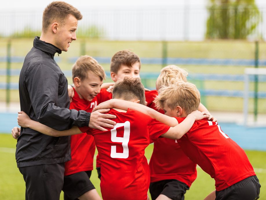 youth soccer coaching equipment soccer players huddling with coach