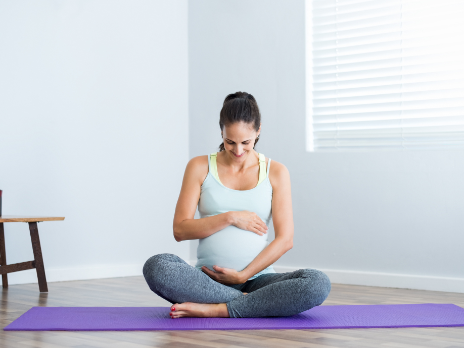 A women sitting in a prenatal yoga center